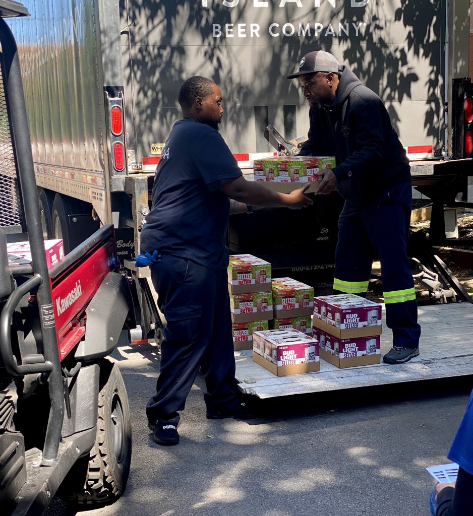 LSB Special Events members unloading cases of beer.