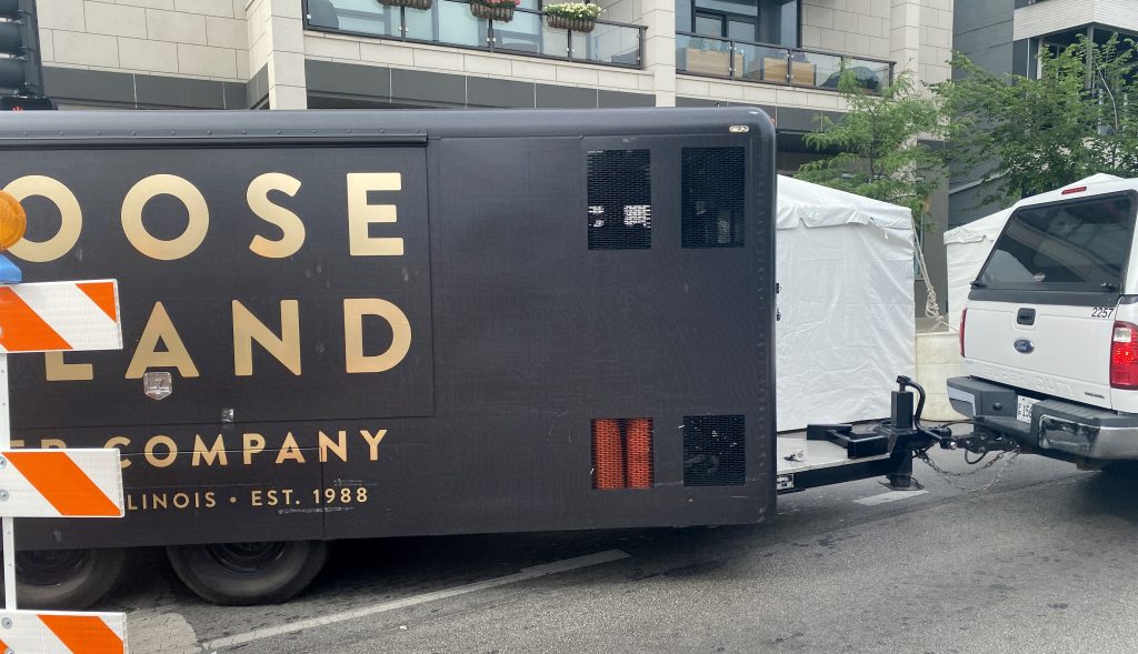 Goose Island trailer hitched to a truck.